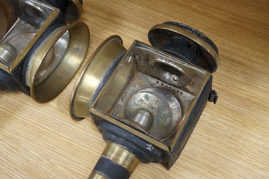 A pair of 19th century brass coaching lamps, 44cm high